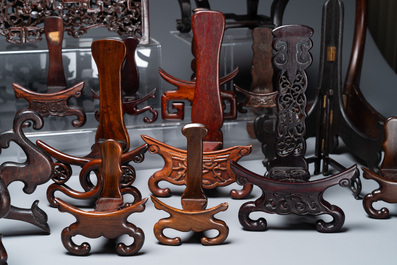 A collection of 26 varied Chinese wooden stands, 2 with marble tops, 19/20th C.