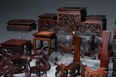 A collection of 26 varied Chinese wooden stands, 2 with marble tops, 19/20th C.