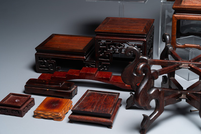 A collection of 26 varied Chinese wooden stands, 2 with marble tops, 19/20th C.