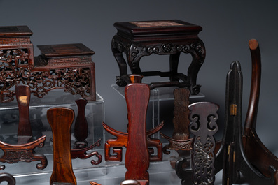 A collection of 26 varied Chinese wooden stands, 2 with marble tops, 19/20th C.