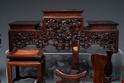 A collection of 26 varied Chinese wooden stands, 2 with marble tops, 19/20th C.