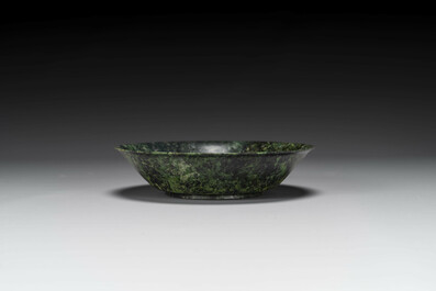 A Chinese dark green jade bowl, 18th C.