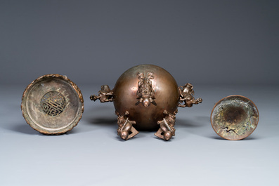 A large Chinese bronze censer and cover on stand decorated with six lions, 19th C.