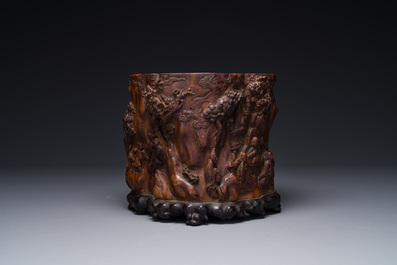 A large Chinese carved huanghuali wooden brush pot with Taoist design, 17/18th C.