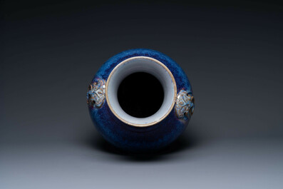 Een grote Chinese flamb&eacute; geglazuurde 'hu' vaas met taotie handvaten, Qing