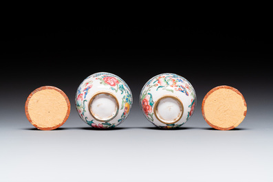 A pair of fine Chinese Canton enamel cups and three saucers with floral design, Yongzheng/Qianlong