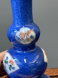 A pair of Chinese famille verte powder-blue-ground triple gourd 'antiquities' vases, Kangxi