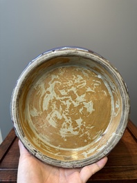 Een grote Chinese flamb&eacute; geglazuurde 'hu' vaas met taotie handvaten, Qing