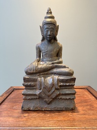 A Burmese partly gilt and lacquered teak wooden Buddha, Hanthawaddy Kingdom, 16th C.