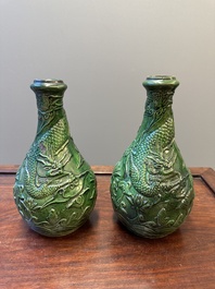 Twee Chinese monochrome groen geglazuurde steengoed vazen met draken en een kendi, Fujian ovens, laat Ming