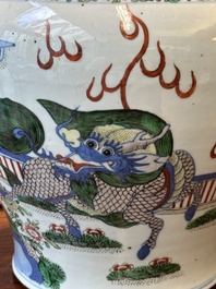 A Chinese wucai 'qilin' baluster vase, 19th C.