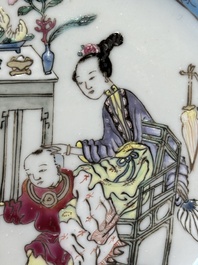 A Chinese famille rose cup and saucer with a court lady and a boy, Yongzheng