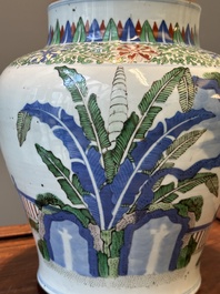 A Chinese wucai 'qilin' baluster vase, 19th C.