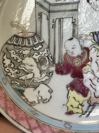 A Chinese famille rose cup and saucer with a court lady and a boy, Yongzheng