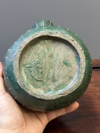 Twee Chinese monochrome groen geglazuurde steengoed vazen met draken en een kendi, Fujian ovens, laat Ming