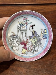 A Chinese famille rose cup and saucer with a court lady and a boy, Yongzheng