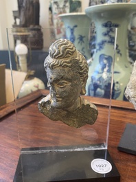 A Gandhara fragment of a stucco Sakyamuni head and a grey schist Bodhisattva head, 1/4th C.