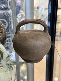 A large collection of nineteen Vietnamese stoneware lime pots, 14th C. and later