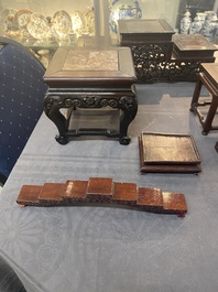 A collection of 26 varied Chinese wooden stands, 2 with marble tops, 19/20th C.