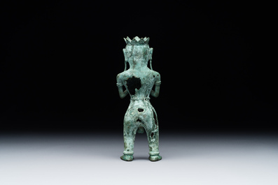 An fine Indonesian bronze sculpture of a naked man offering a sacrificial vase, Majapahit, East Java, 13/14th C.