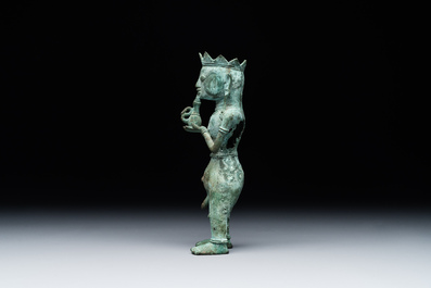 An fine Indonesian bronze sculpture of a naked man offering a sacrificial vase, Majapahit, East Java, 13/14th C.