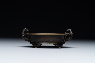 A rare Chinese bronze narcissus basin-shaped censer with dragon handles, Xuande mark, 17th C.