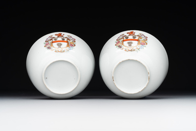 A pair of Chinese armorial famille rose cups and saucers with the arms of Tyndall for the English market and two monogrammed bowls, Qianlong