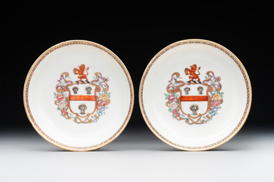 A pair of Chinese armorial famille rose cups and saucers with the arms of Tyndall for the English market and two monogrammed bowls, Qianlong