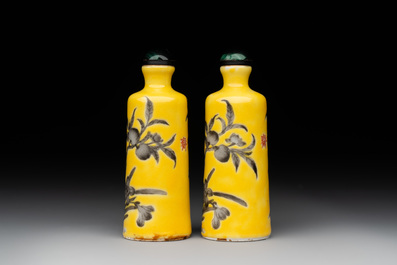 A pair of Chinese grisaille yellow-ground Dayazhai-style snuff bottles, Yong Qing Chang Chun 永慶長春 mark, 19th C.