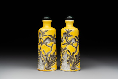 A pair of Chinese grisaille yellow-ground Dayazhai-style snuff bottles, Yong Qing Chang Chun 永慶長春 mark, 19th C.