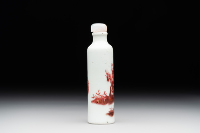 A Chinese copper-red snuff bottle with travellers in a landscape, Qianlong mark, 19th C.