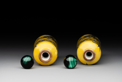 A pair of Chinese grisaille yellow-ground Dayazhai-style snuff bottles, Yong Qing Chang Chun 永慶長春 mark, 19th C.