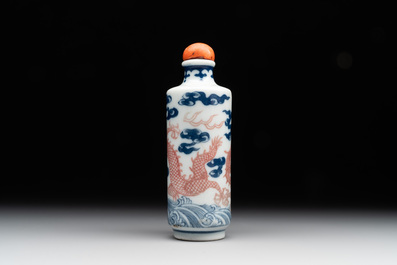 A Chinese blue, white and copper-red 'dragon' snuff bottle, 19th C.
