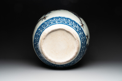 A pair of Chinese blue, white and copper-red 'dragon' fish bowls, Qianlong