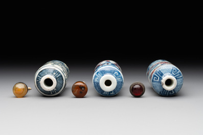 Three Chinese blue, white and copper-red snuff bottles, 19th C.