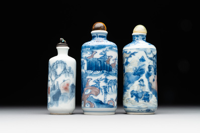 Three Chinese blue, white and copper-red snuff bottles, Yongzheng mark, 19/20th C.