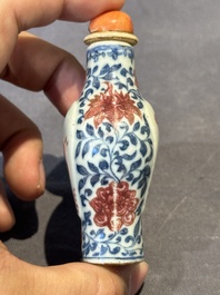 A Chinese blue, white and copper-red snuff 'deer' bottle, Yongzheng mark and of the period