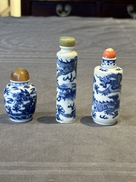 Three Chinese blue and white 'dragon' snuff bottles, 19th C.