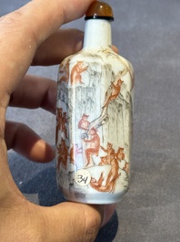 A Chinese iron-red and grisaille snuff bottle with monkeys at the Shuilian cave, 19th C.
