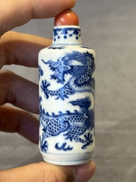 Three Chinese blue and white 'dragon' snuff bottles, 19th C.