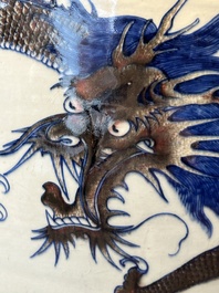 A pair of Chinese blue, white and copper-red 'dragon' fish bowls, Qianlong