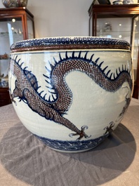 A pair of Chinese blue, white and copper-red 'dragon' fish bowls, Qianlong