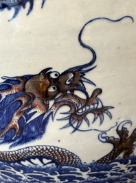 A pair of Chinese blue, white and copper-red 'dragon' fish bowls, Qianlong