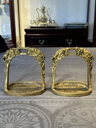 A pair of Chinese imperial gilt-bronze stirrups with dragons, De 德 mark, 18th C.