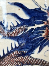 A pair of Chinese blue, white and copper-red 'dragon' fish bowls, Qianlong