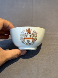 A pair of Chinese armorial famille rose cups and saucers with the arms of Tyndall for the English market and two monogrammed bowls, Qianlong