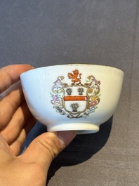 A pair of Chinese armorial famille rose cups and saucers with the arms of Tyndall for the English market and two monogrammed bowls, Qianlong