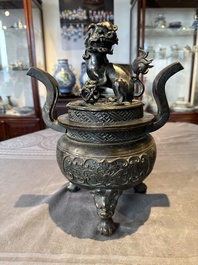 A large Chinese bronze censer and cover with a Buddhist lion, Ming