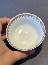 A pair of Chinese armorial famille rose cups and saucers with the arms of Tyndall for the English market and two monogrammed bowls, Qianlong