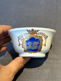 A pair of Chinese armorial famille rose cups and saucers with the arms of Tyndall for the English market and two monogrammed bowls, Qianlong